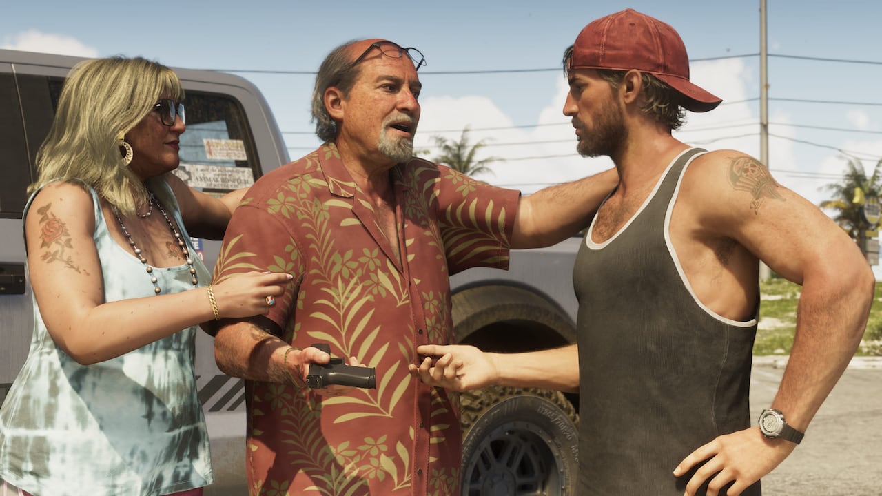 Brian Heder talks with Jason and a woman beside a vehicle