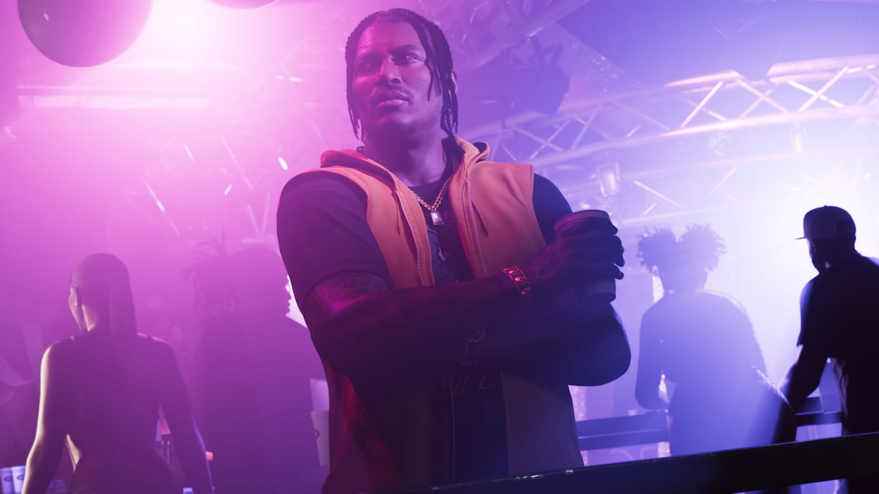 Dre'Quan Priest watches a performance from a nightclub balcony