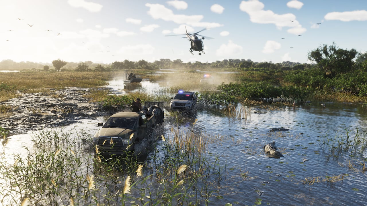 Off-road riders race through shallow water in the Grassrivers wetlands